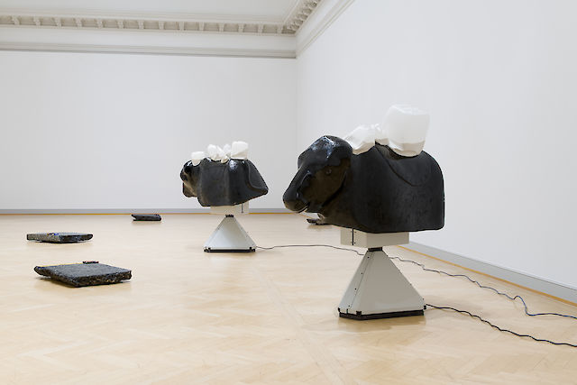 Nina Beier, Beast, 2018, robot bull simulators and containers of powdered milk, dimensions variable