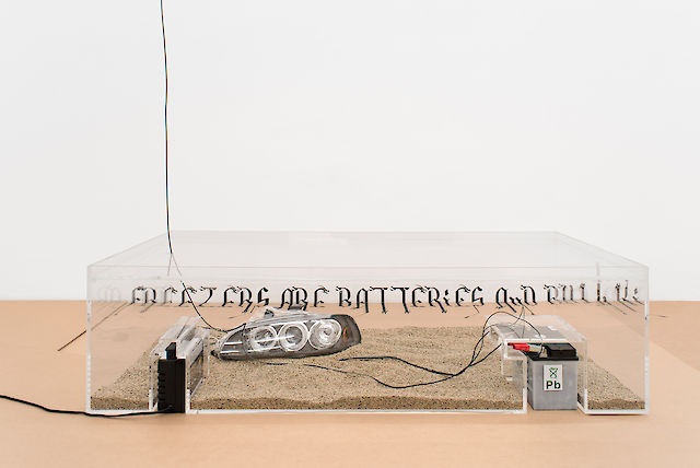 Ben Schumacher, Irritations and Latent Utopias, 2013, Plexiglas, car headlights, car battery, charger, rye seeds, 39&nbsp;×&nbsp;149.5&nbsp;×&nbsp;68 cm