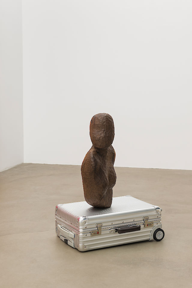 Marie Lund, Clickety Click, 2012, Aluminium suitcase, carved wooden figure, 55×40×20cm