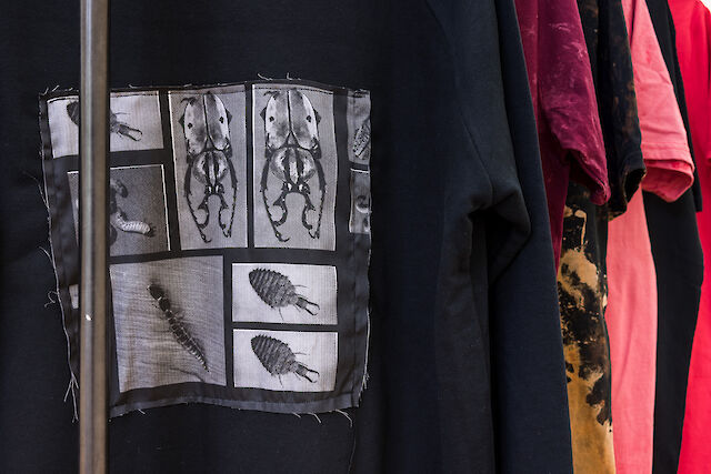 Benoît Maire Tee-shirts Rack , 2022 (detail), Metal, printed cotton, plastic labels, 162&nbsp;×&nbsp;110&nbsp;×&nbsp;50 cm
