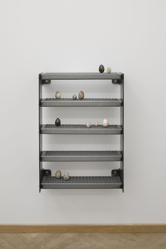 Nina Beier, Nest, 2022, Stone eggs, metal, hardware, 90&nbsp;×&nbsp;61&nbsp;×&nbsp;21.4 cm