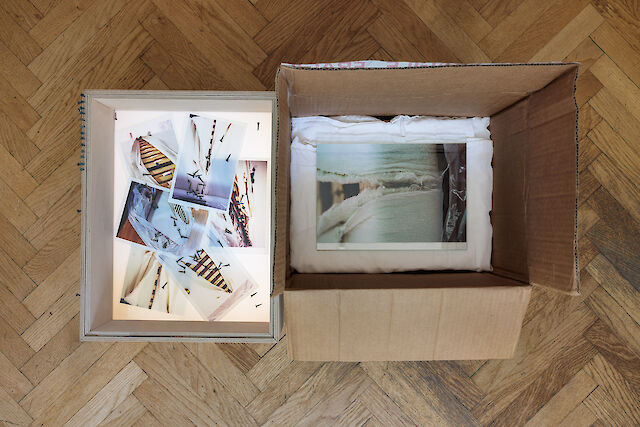 Patricia L. Boyd 88. Kitchenware (submission) (Contents in the Storage Problem), 2023, Moving box, plywood light box, pillowcase, prints, upholstery nails, glass, 49&nbsp;×&nbsp;73&nbsp;×&nbsp;48.5 cm