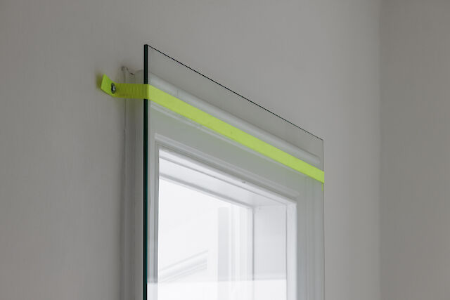 Mandla Reuter, Diorama, 2023 (detail), Doorway, glass, strap, screws, dimensions variable